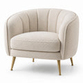 Fauteuil arrondi en tissu bouclette beige avec pieds en laiton