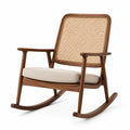 Fauteuil à bascule en bois de noyer avec dossier en rotin et coussin en lin beige